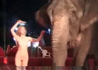 Nude blonde and an elephant