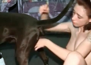 Twisted brunette fucking a hound